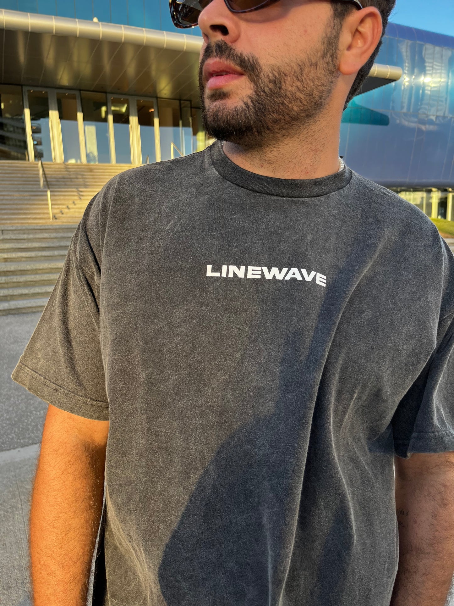 Remera over negra wave nevada