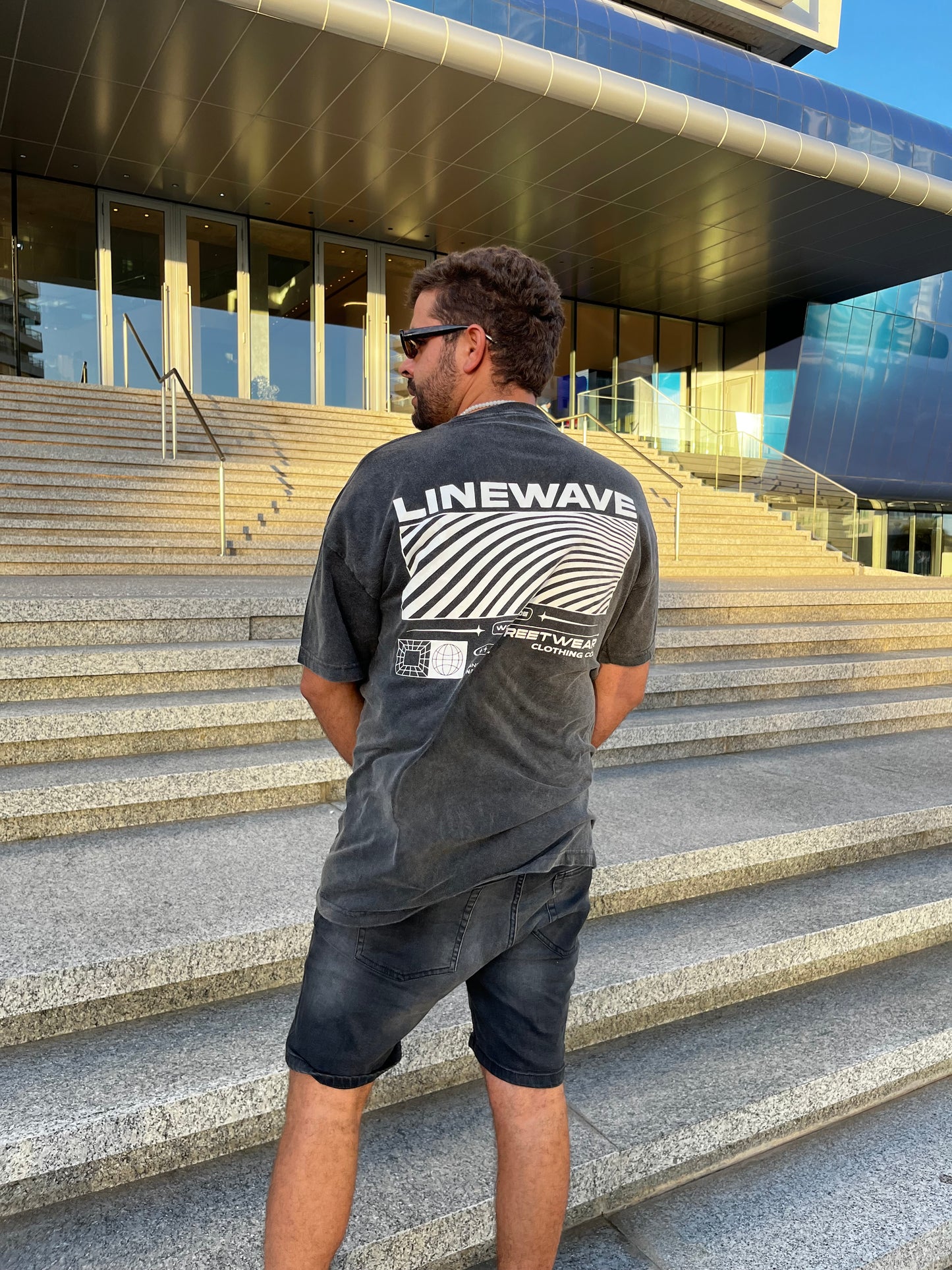 Remera over negra wave nevada